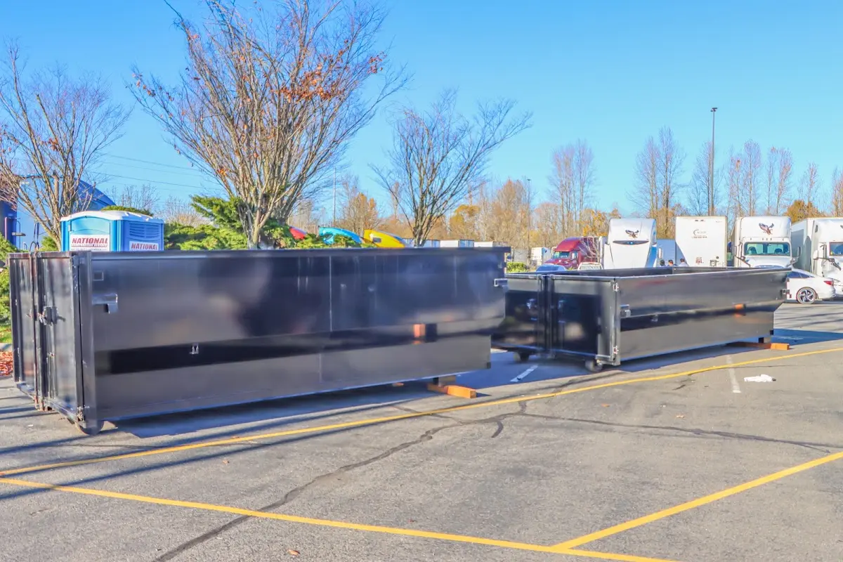 Professional dumpster rental service with roll-off container on residential driveway in Hellertown